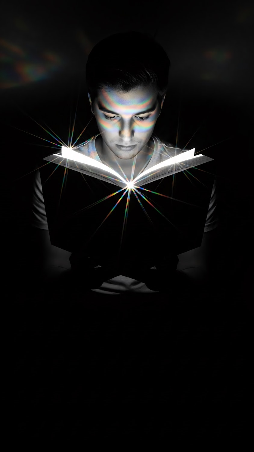 A reader captivated by the pages of a thought-provoking dystopian novel, lost in its complex world.