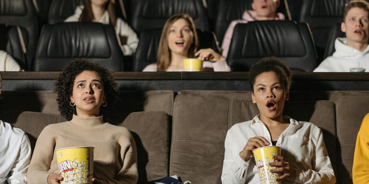 Illustrating the communal experience of enjoying stories brought to life on screen.