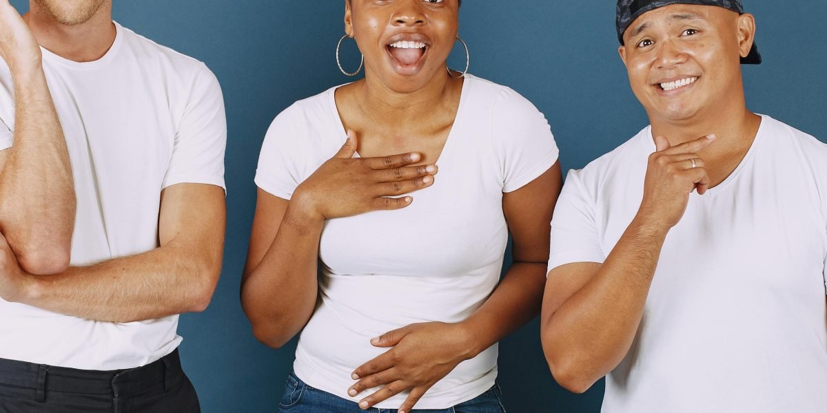 Friends gathered around a phone, sharing a laugh and reacting to surprising content, much like the widespread reaction to the Dancing Baby meme.