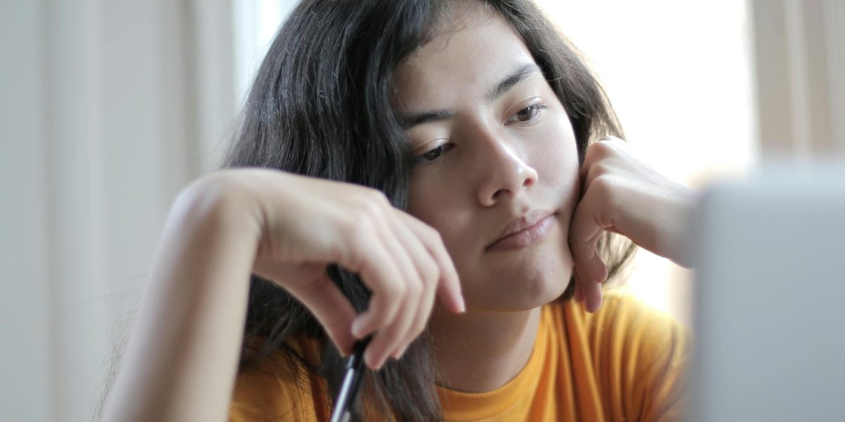 A person reflecting deeply, symbolizing the introspective journey inspired by The Giver.