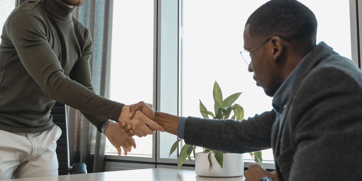 Two individuals engaging in a respectful discussion, representing the importance of permission and ethics.